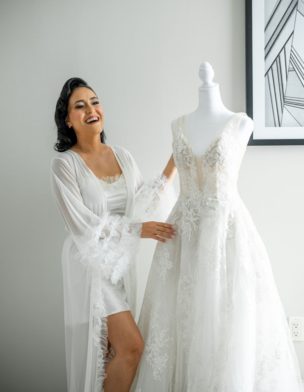 Joyful moments captured while admiring a wedding dress on display.