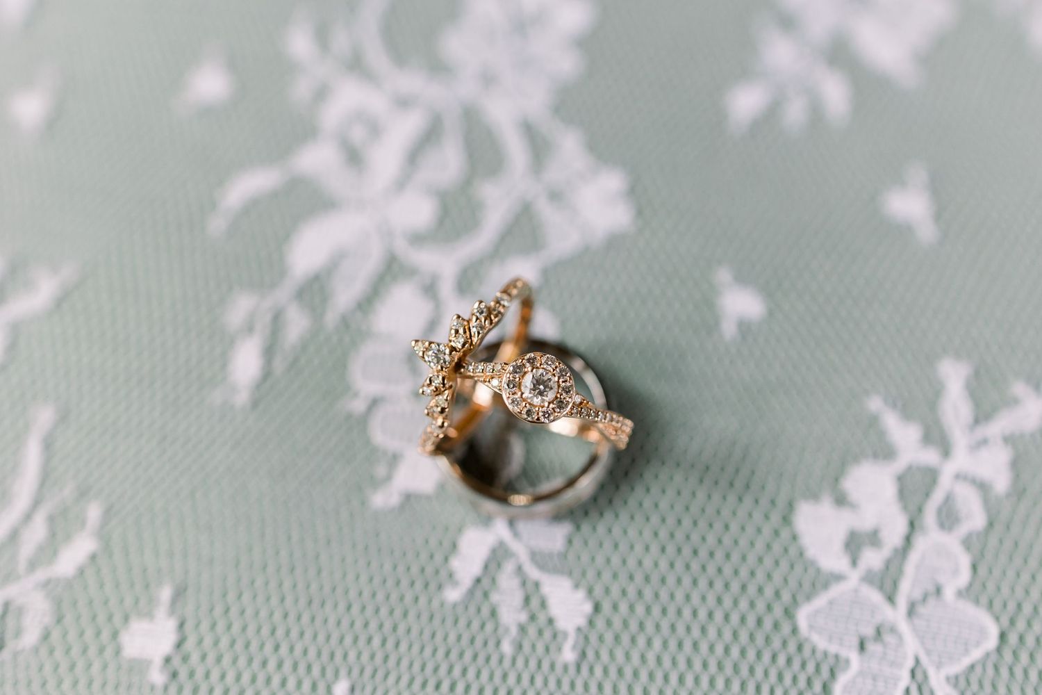 Delicate floral lace pattern photographed in soft pastel tones.