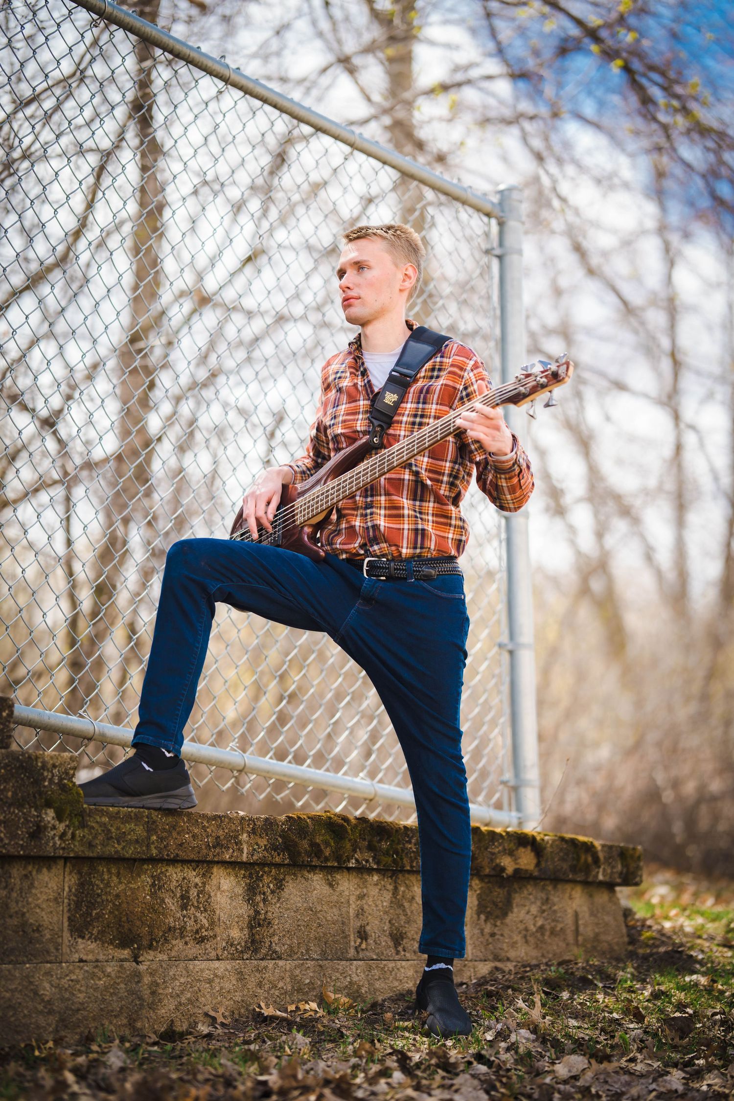 A person poses for a solo portrait, exuding confidence and style in front of the camera.