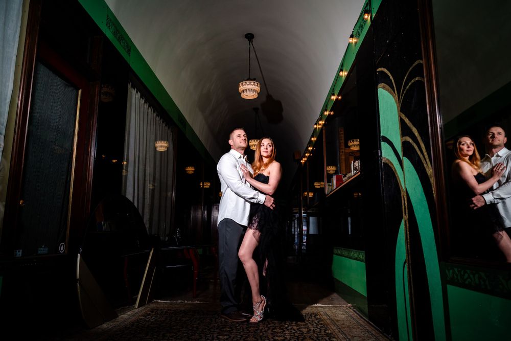 Dramatic dance poses captured in a dimly lit hallway with green accents.