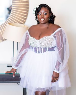 A romantic portrait session featuring a white sheer tulle dress in an elegant indoor setting.