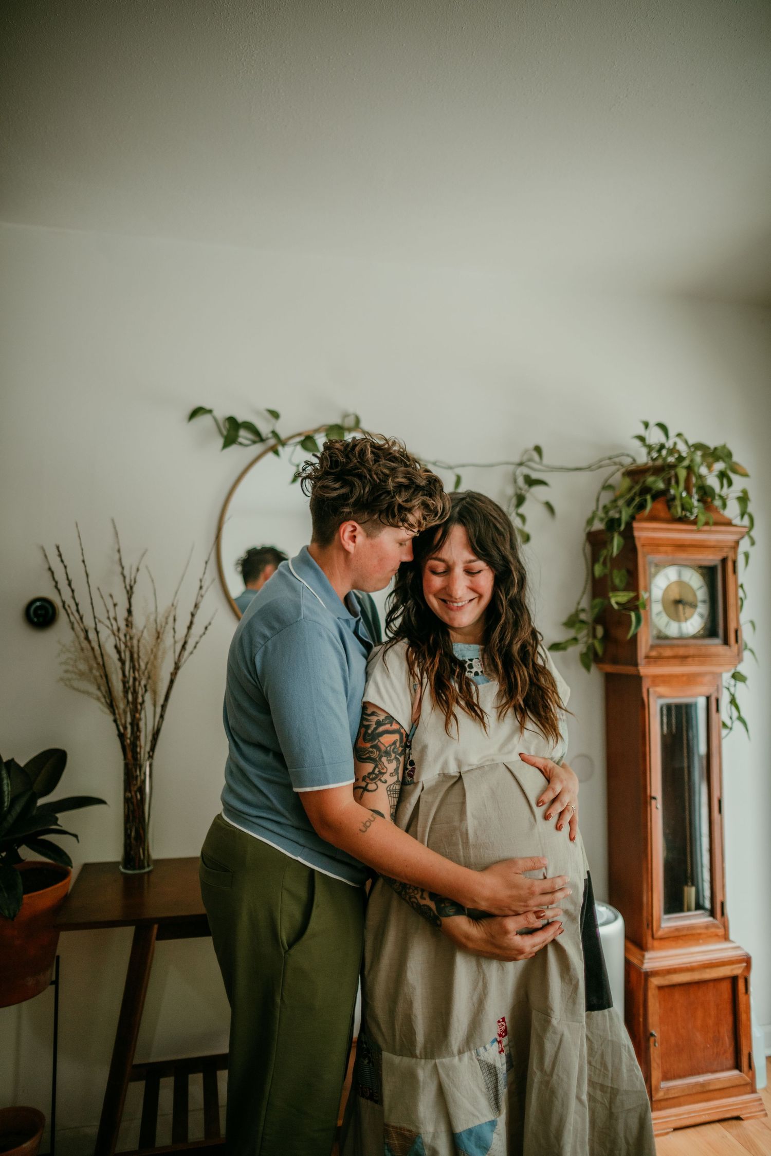 queer couple poses for maternity photo portland oregon rushes & waves