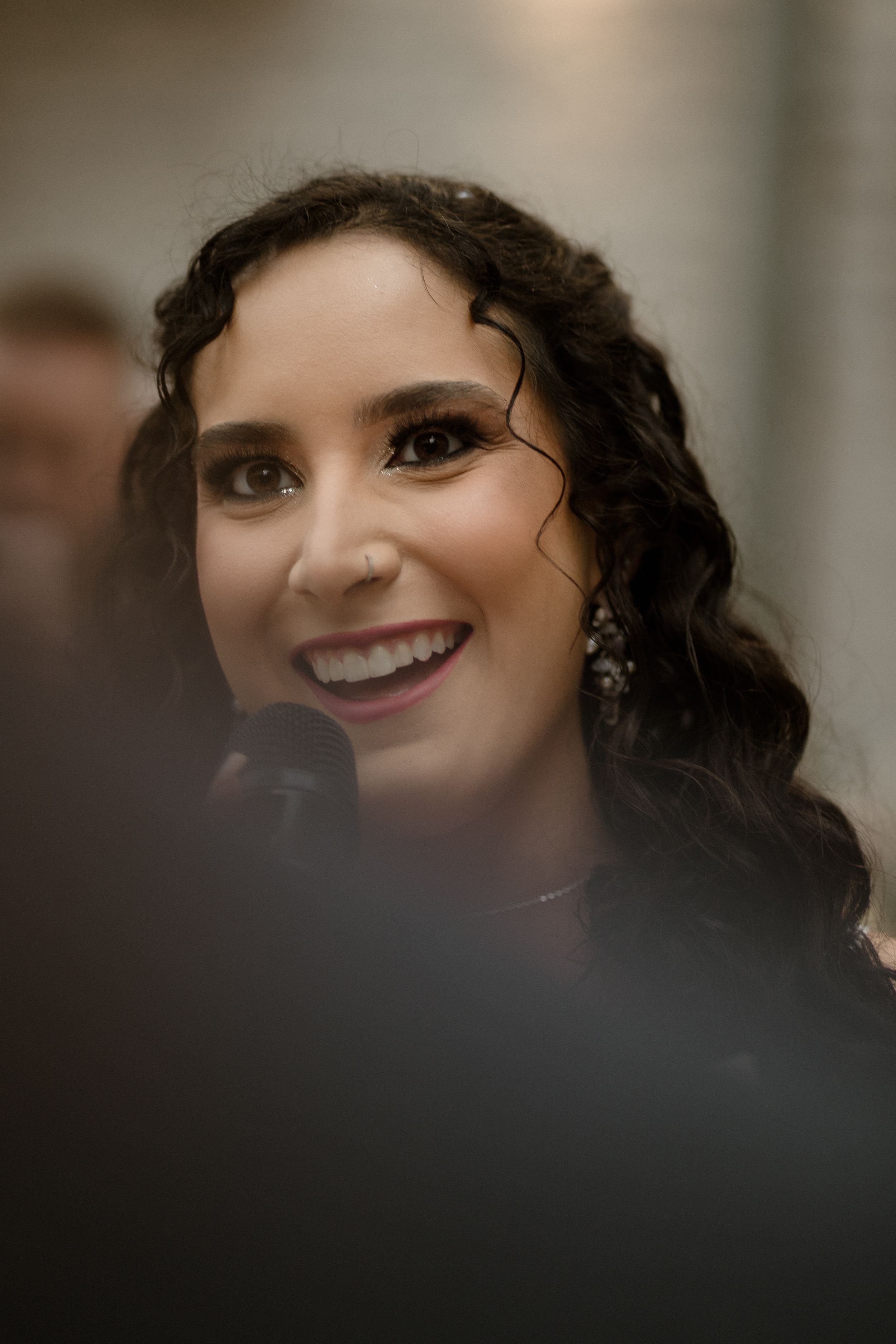 Artistic wedding portrait showing emotion through blurred foreground.