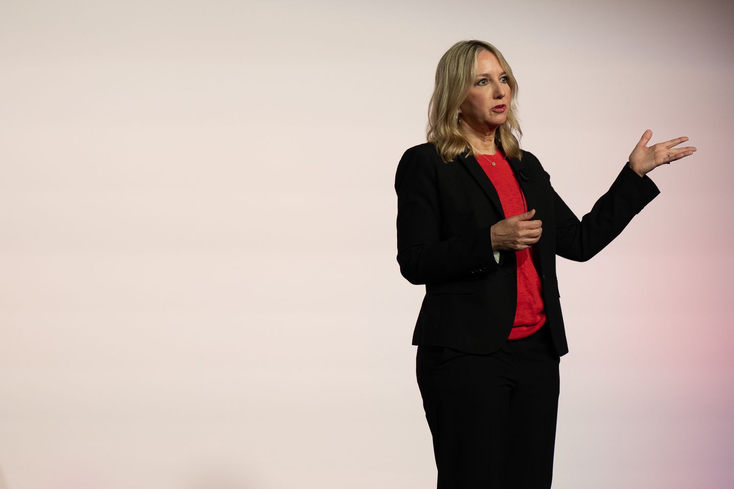 A speaker onstage at the Enablon 2024 conference in Houston, TX.