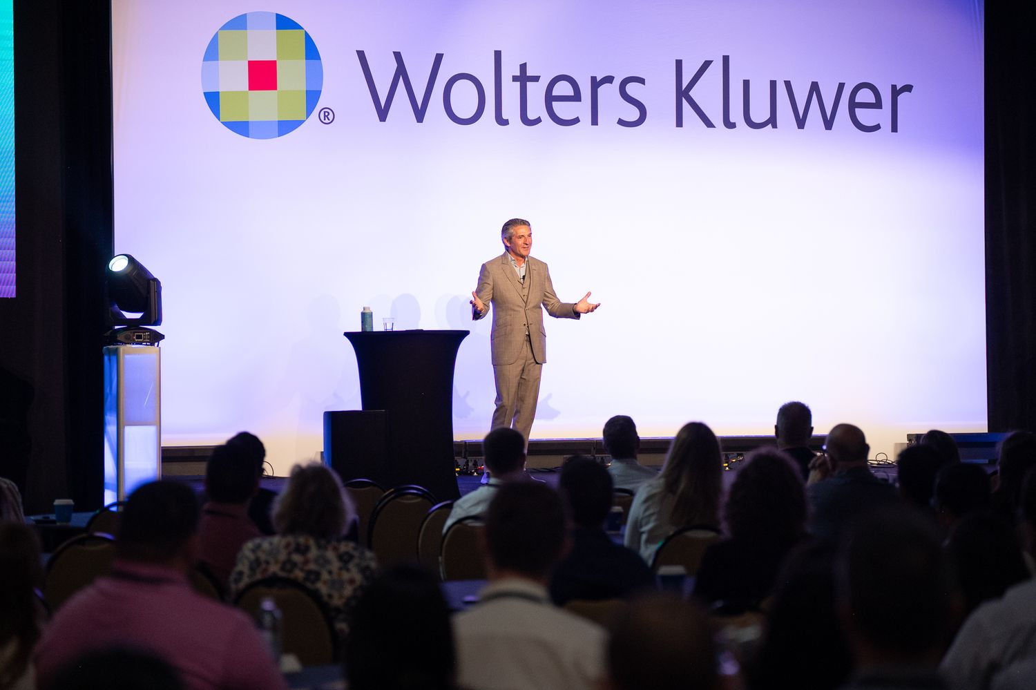 A speaker onstage at the Enablon 2024 conference in Houston, TX.
