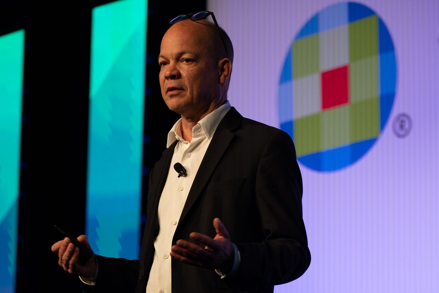 A speaker onstage at the Enablon 2024 conference in Houston, TX.