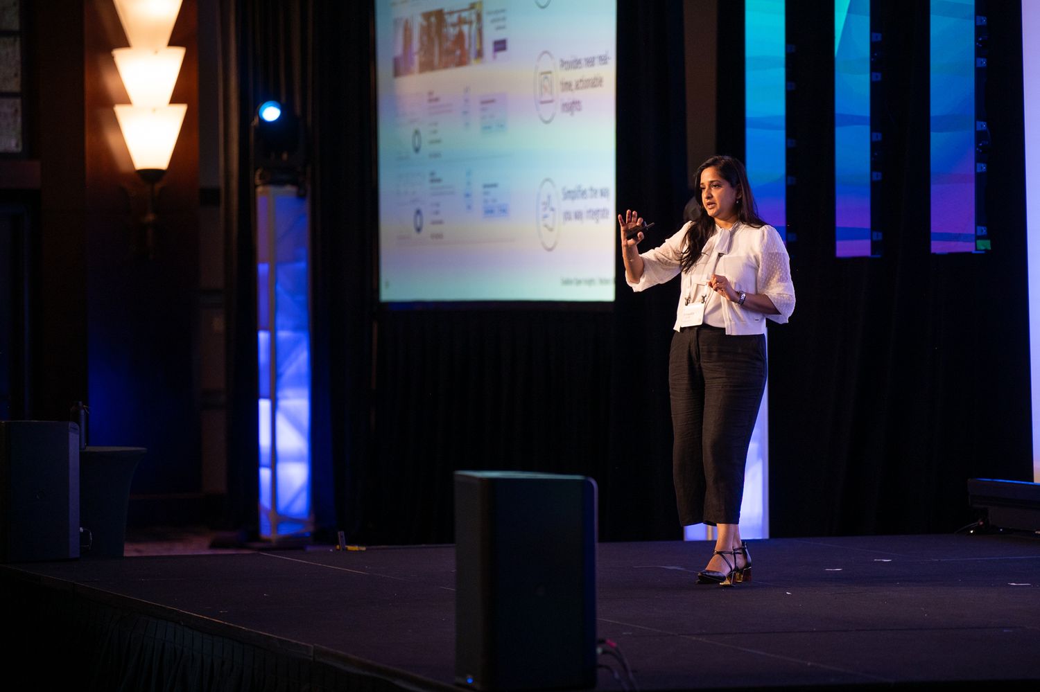 A speaker onstage at the Enablon 2024 conference in Houston, TX.