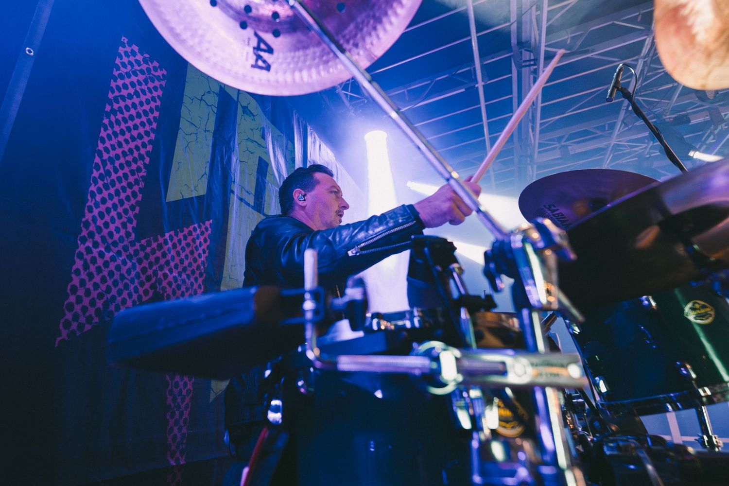 Nightclub scene with purple lighting and disco ball creating atmospheric dance floor ambiance.