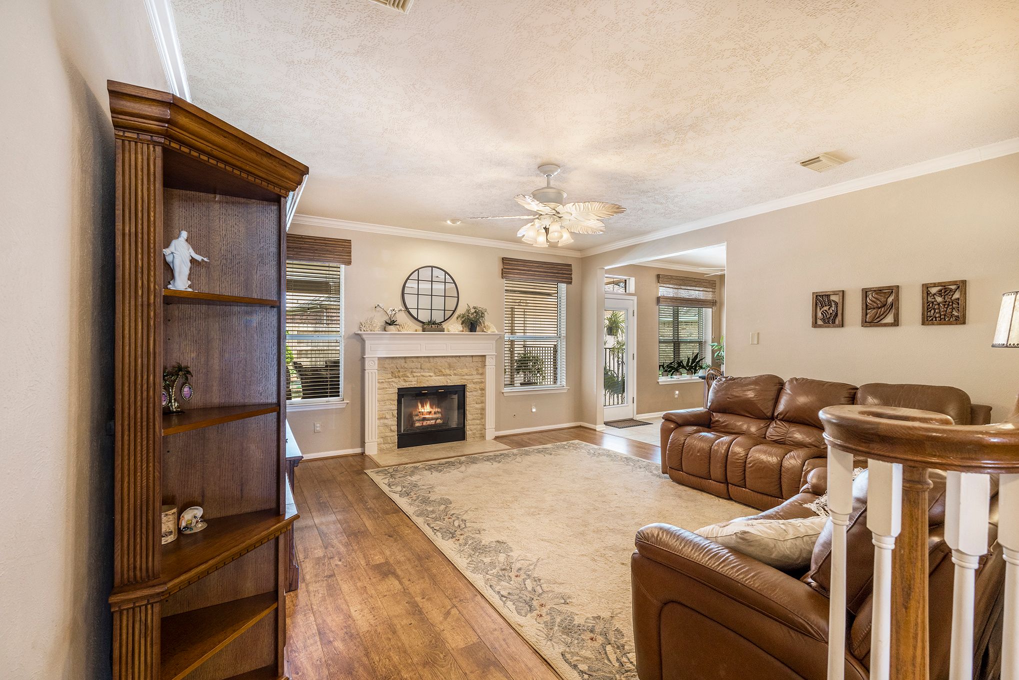 A collage of interior room photos showing spacious living areas, hardwood floors, and neutral-toned decor.