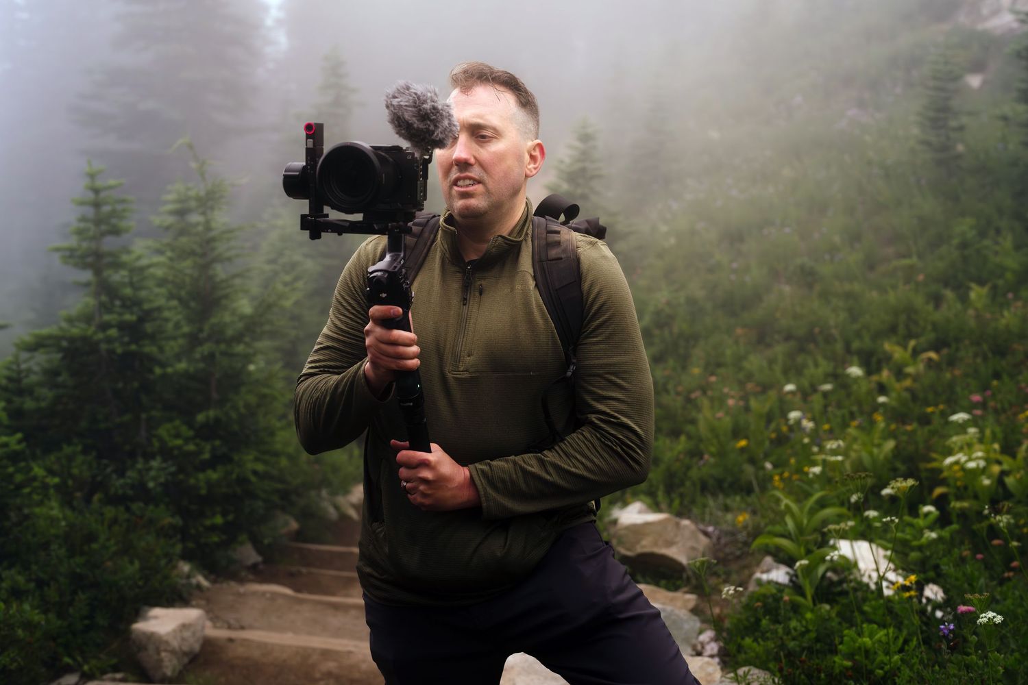 Clint Swindell holding DJI RS5 gimbal at Mt Rainier for a sunrise elopement.