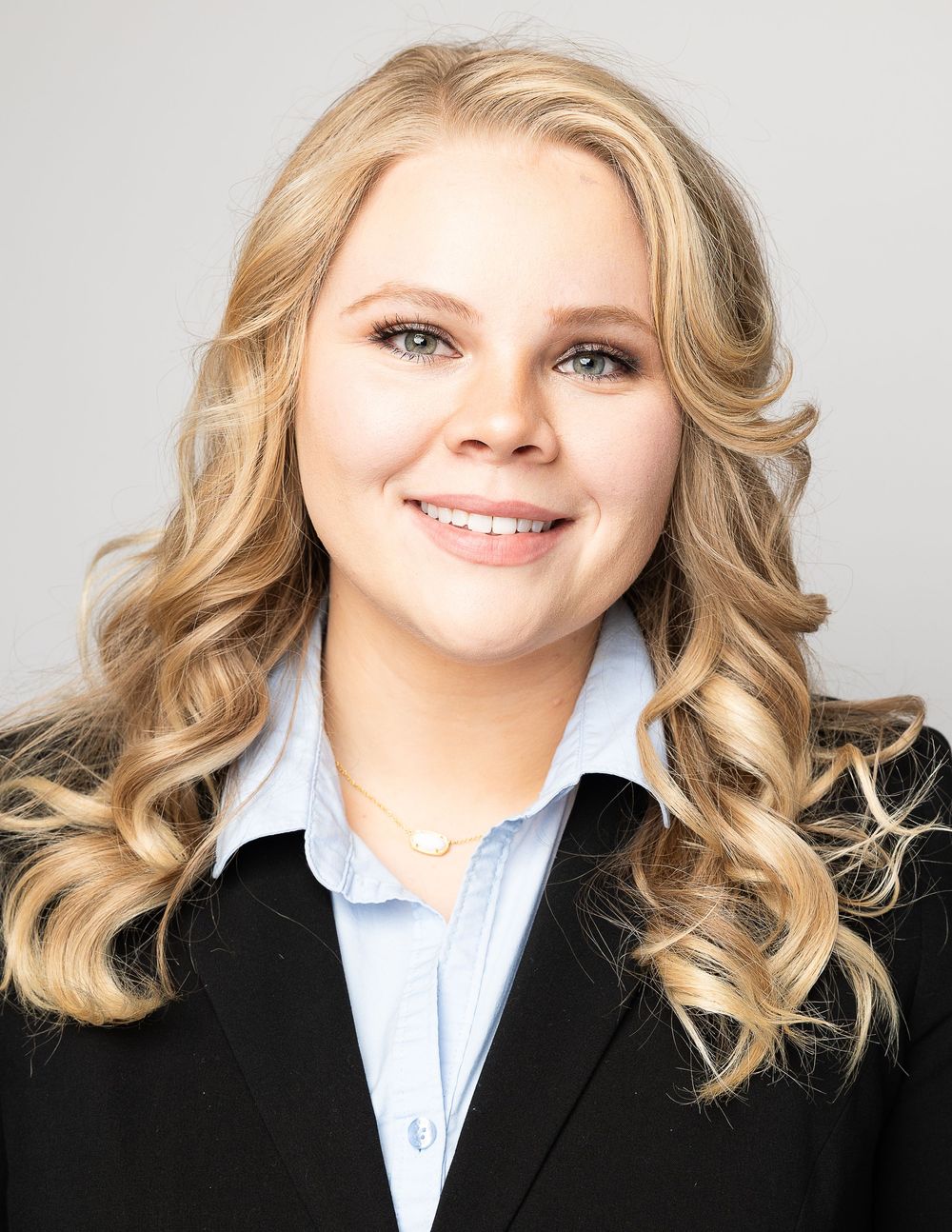 Professional headshot series showing blonde wavy hair and business attire against white background.