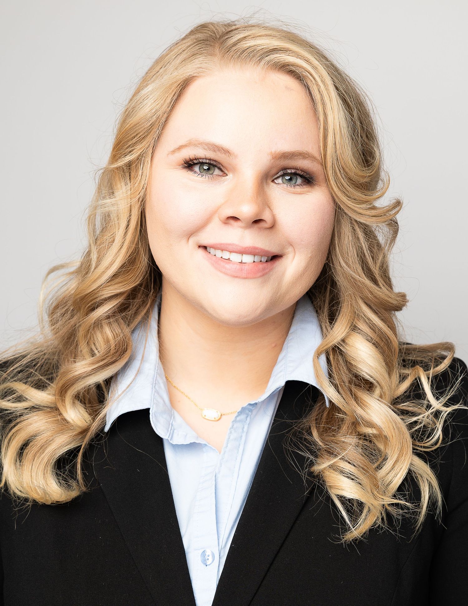 Professional headshot series showing blonde wavy hair and business attire against white background.