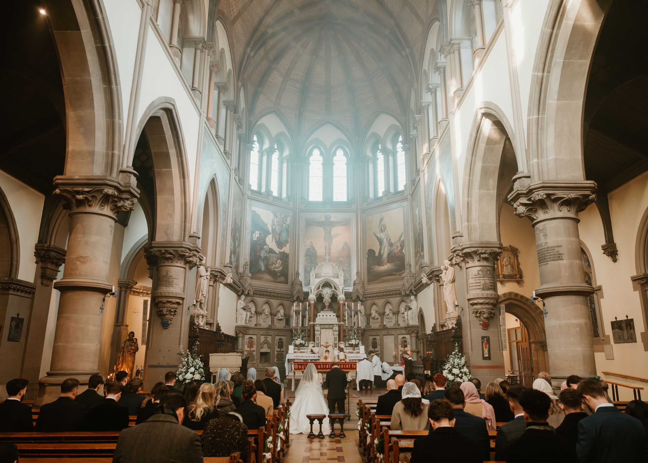 Gothic church interior with vaulted ceilings and arched windows photographed in a panoramic sequence.