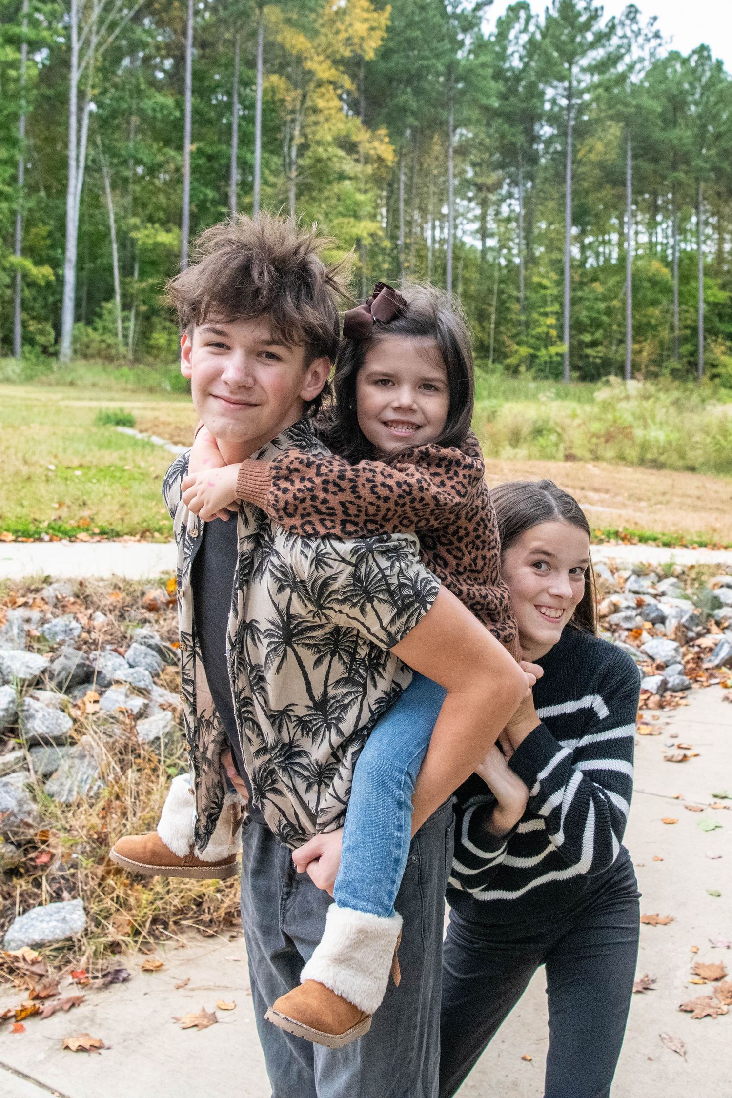 Three sequential photos showing a warm embrace between two people outdoors during autumn.