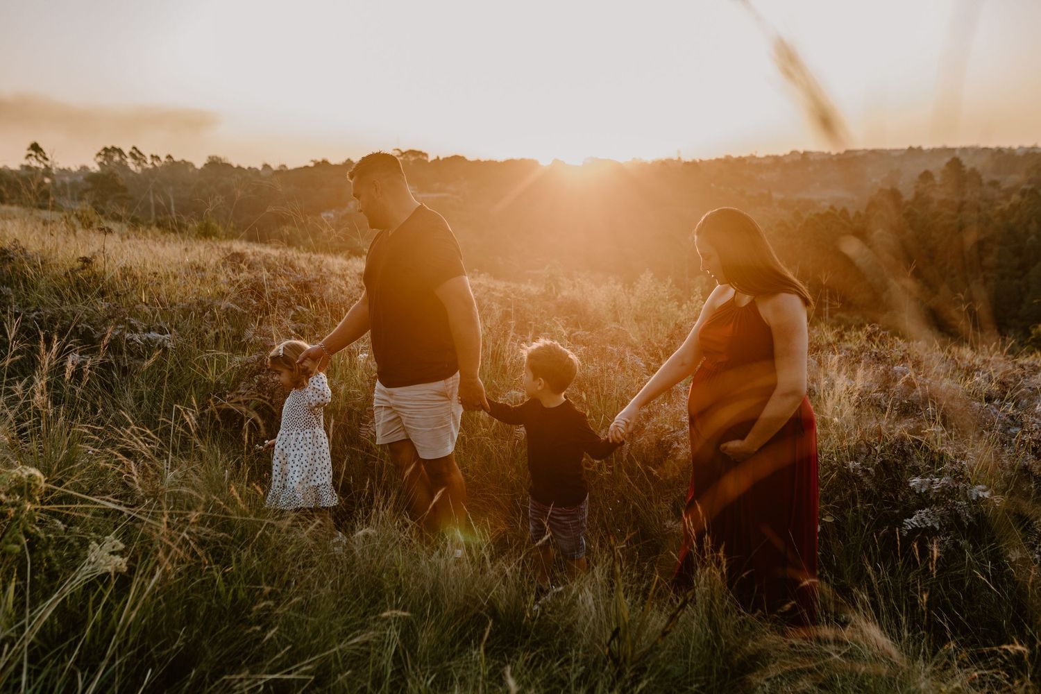 family walking through grass