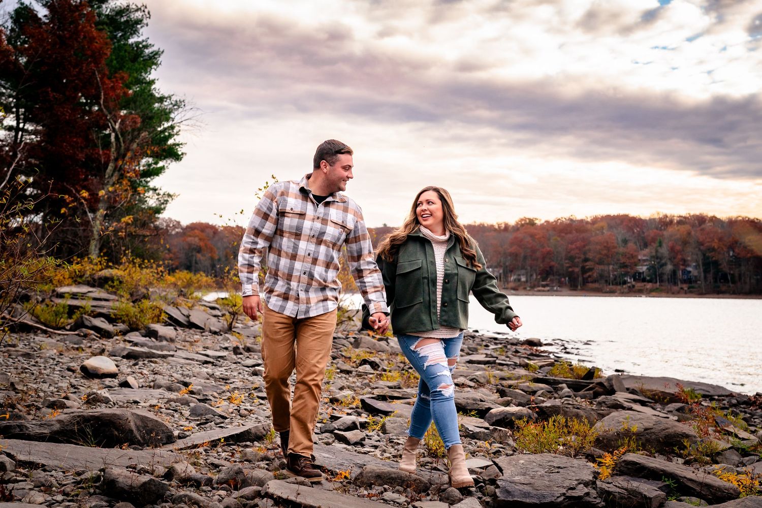 couple walking near Beliztville State Park after he proposed in Jim Thorpe, PA