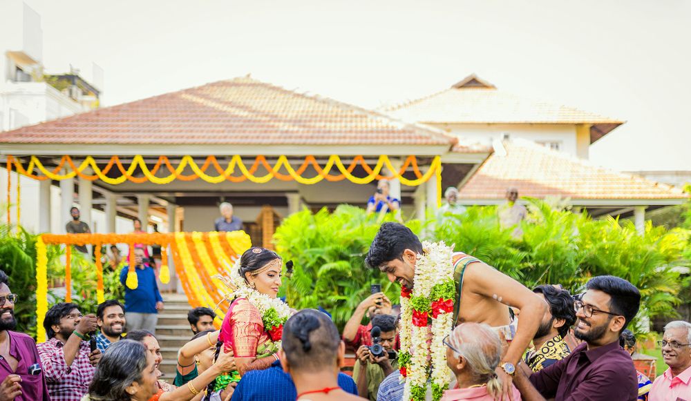 A festive outdoor celebration with colorful marigold garlands decorating the venue.