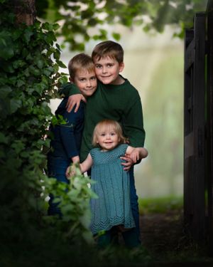 children stood in between an ancient gate