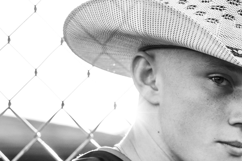 Senior boy wearing his cowboy hat taken at sunset in Sergeant Bluff