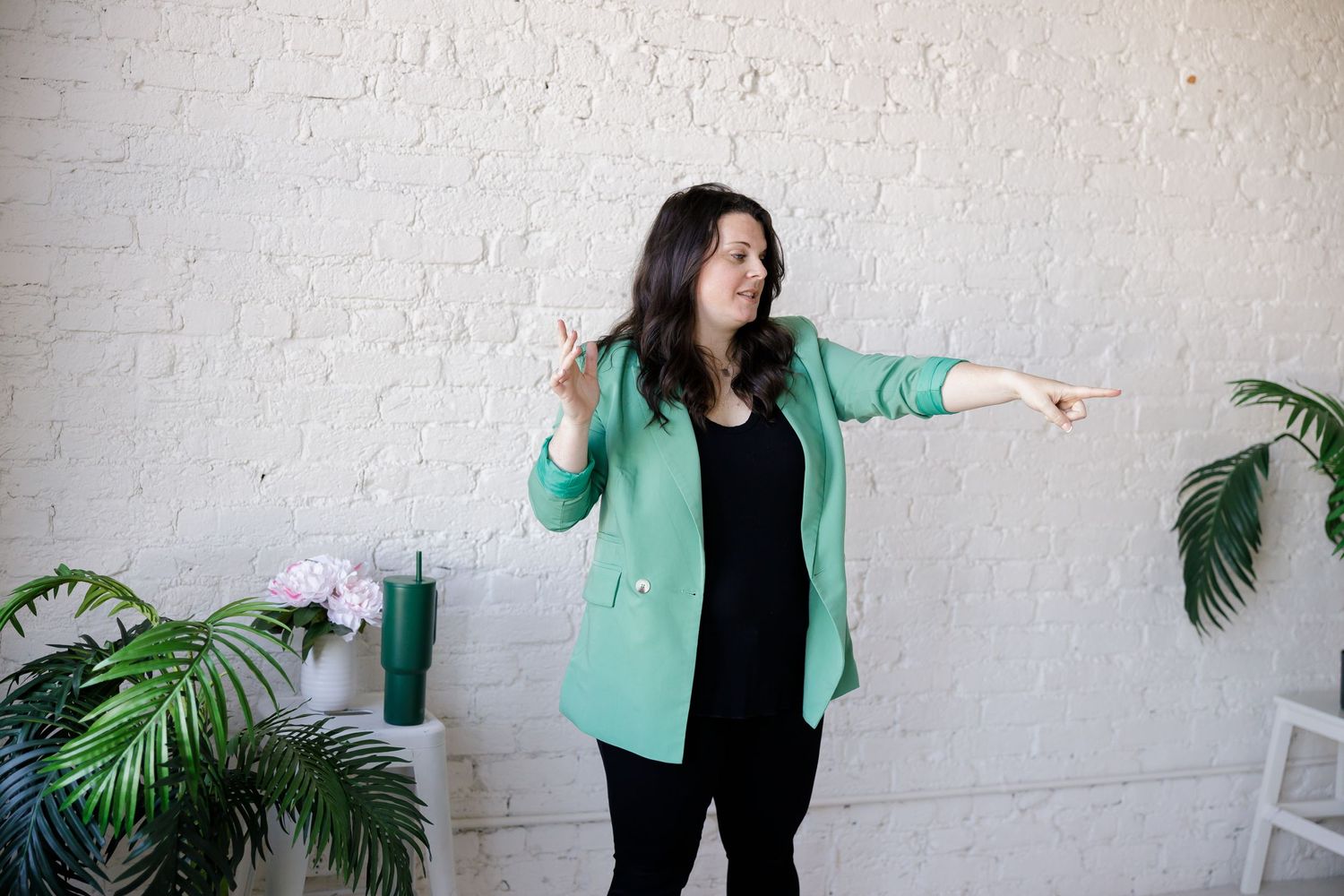 Woman burnout coach in Tacoma, WA GRLS Studio Personal branding photoshoot speaking to audience pointing to woman
