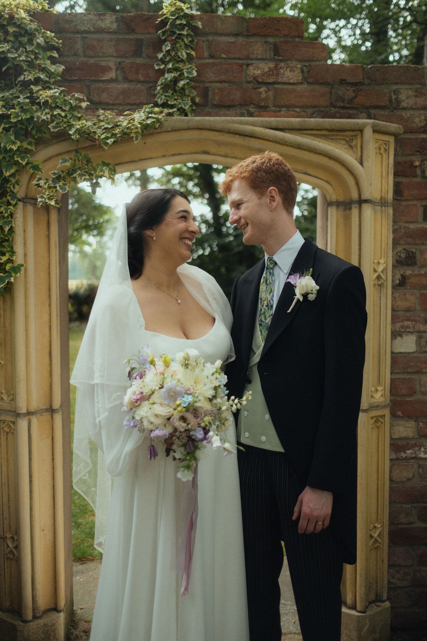 Bride and Groom looking at each other during couple shoot post ceremony at Moxhull Hall