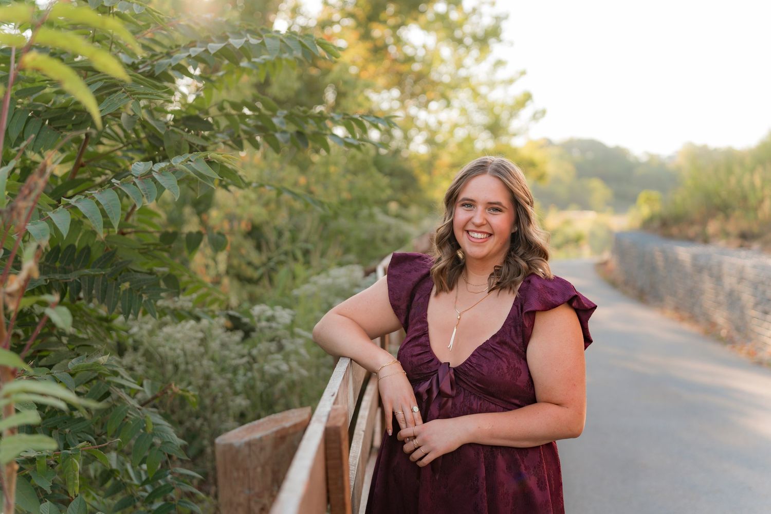 Fall portrait surrounded by golden maple leaves and autumn colors.