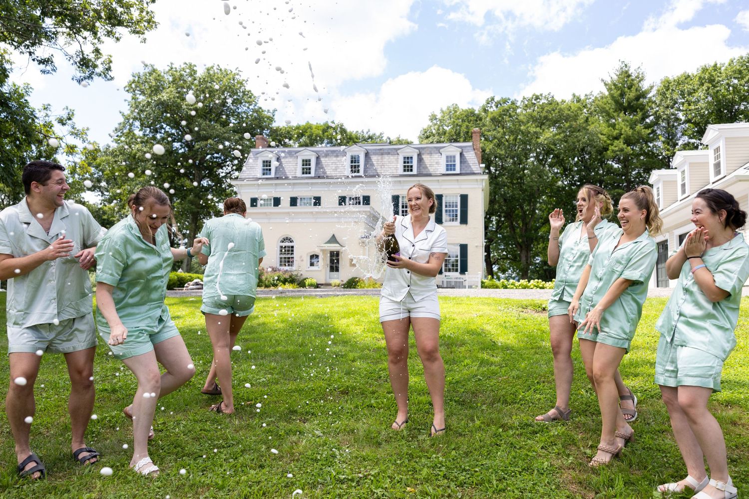 Bridal party champagne pop.