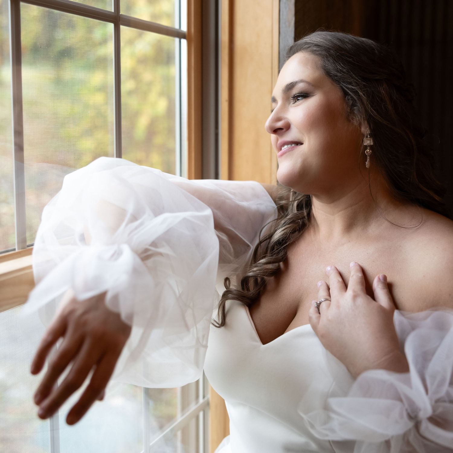 Bridal portrait, natural light at the window.