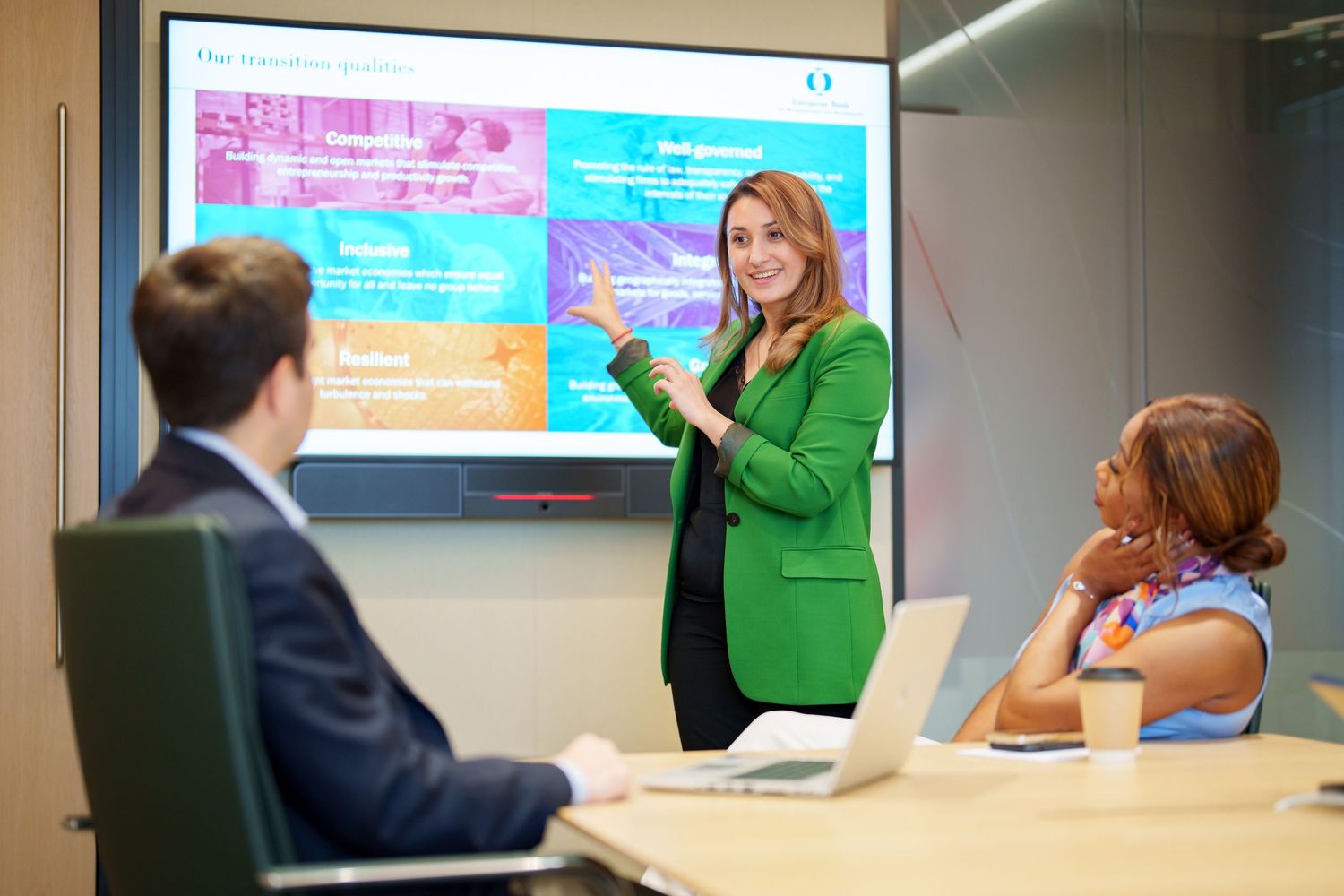 Woman presenting a slide in a conference room