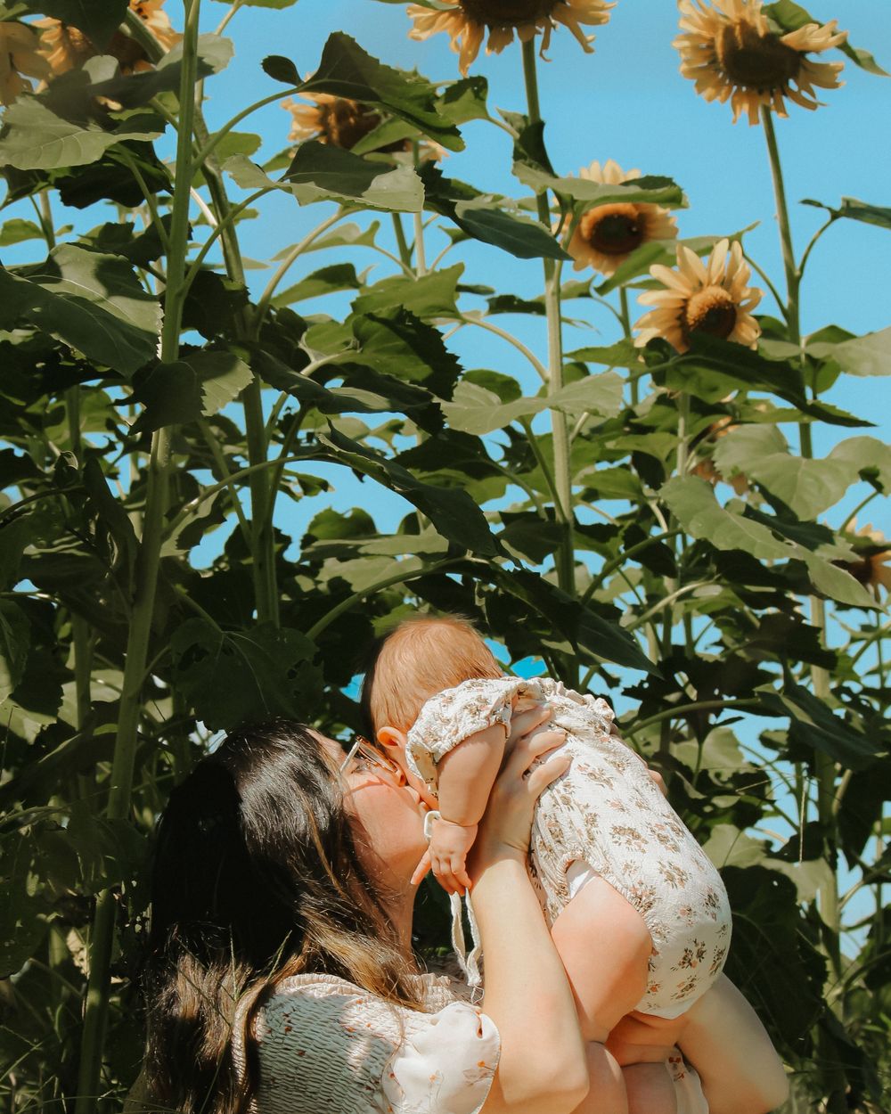 Family lifestyle portraits in OKC with candid connection at Sunny Acres Farms in Mounds, Oklahoma.