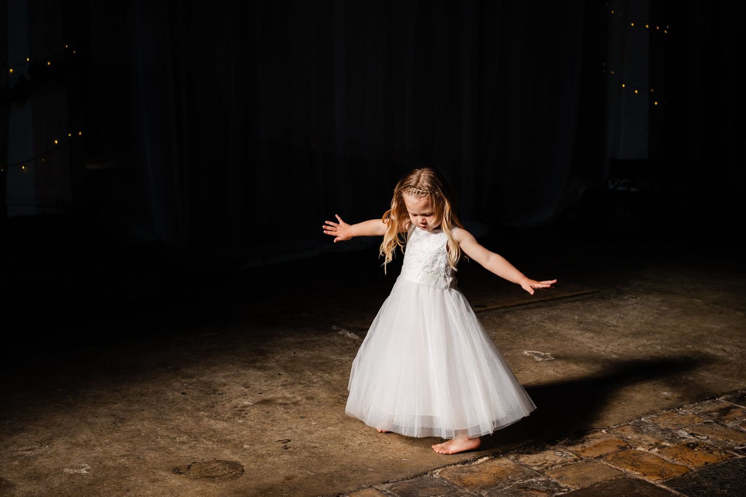 Flower girl dancing at a wedding in kent at st Marys art centre in Deal