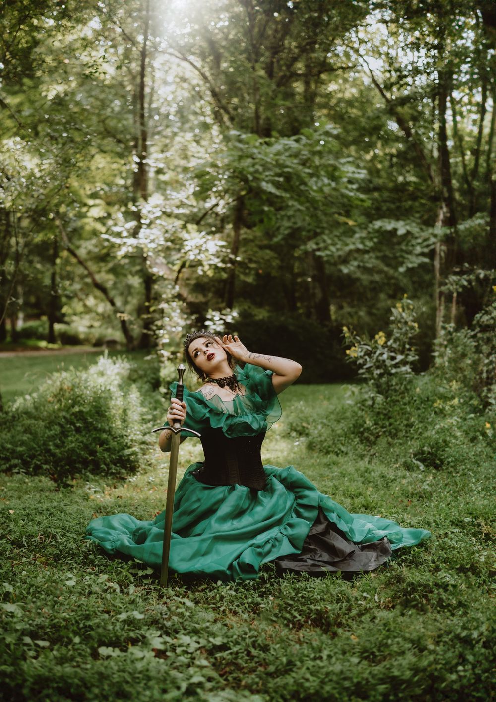 Creative poisoned apple photoshoot with models in dark costumes and cauldron smoke, Asheville, North Carolina.