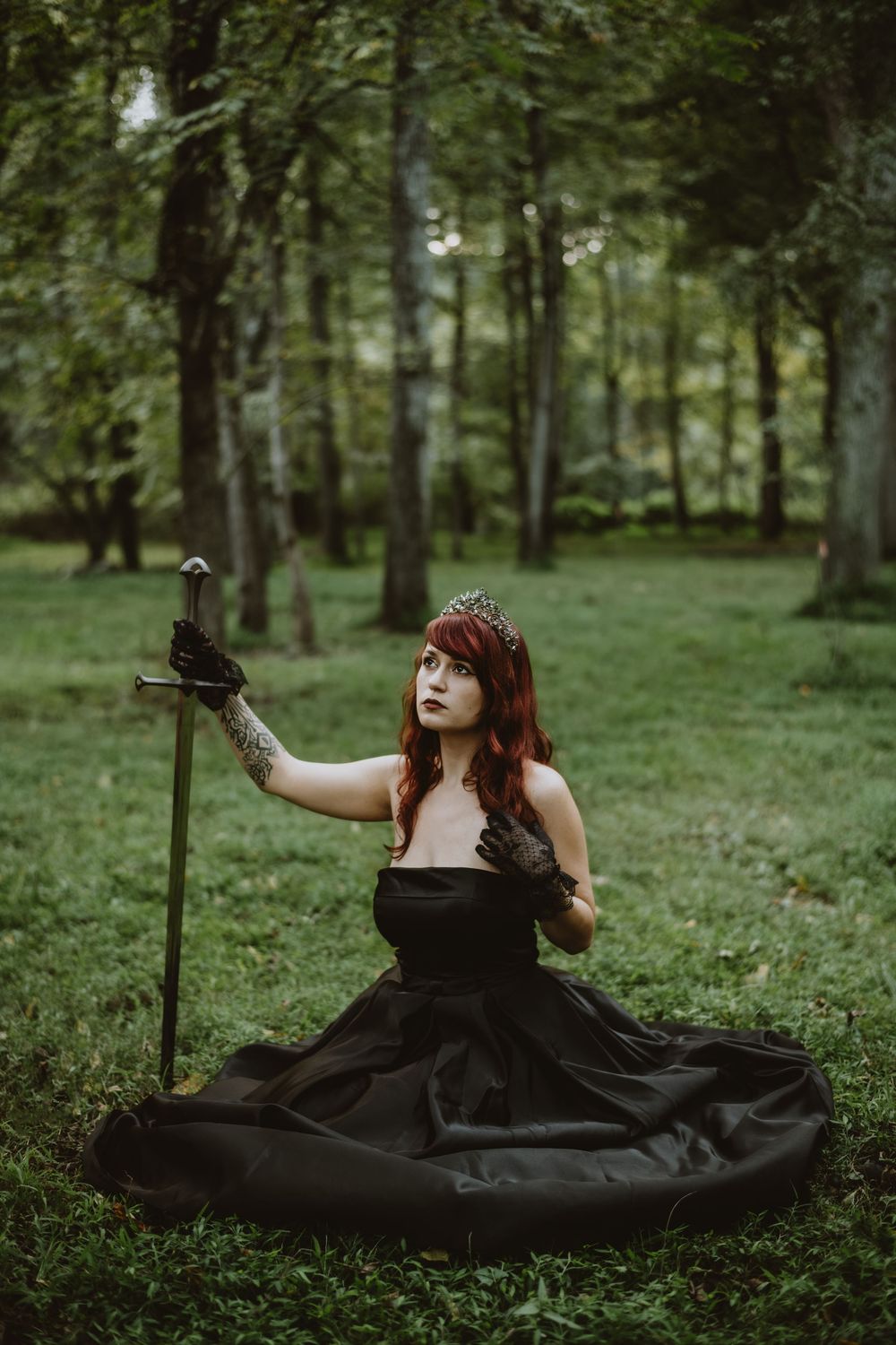 Creative poisoned apple photoshoot with models in dark costumes and cauldron smoke, Asheville, North Carolina.