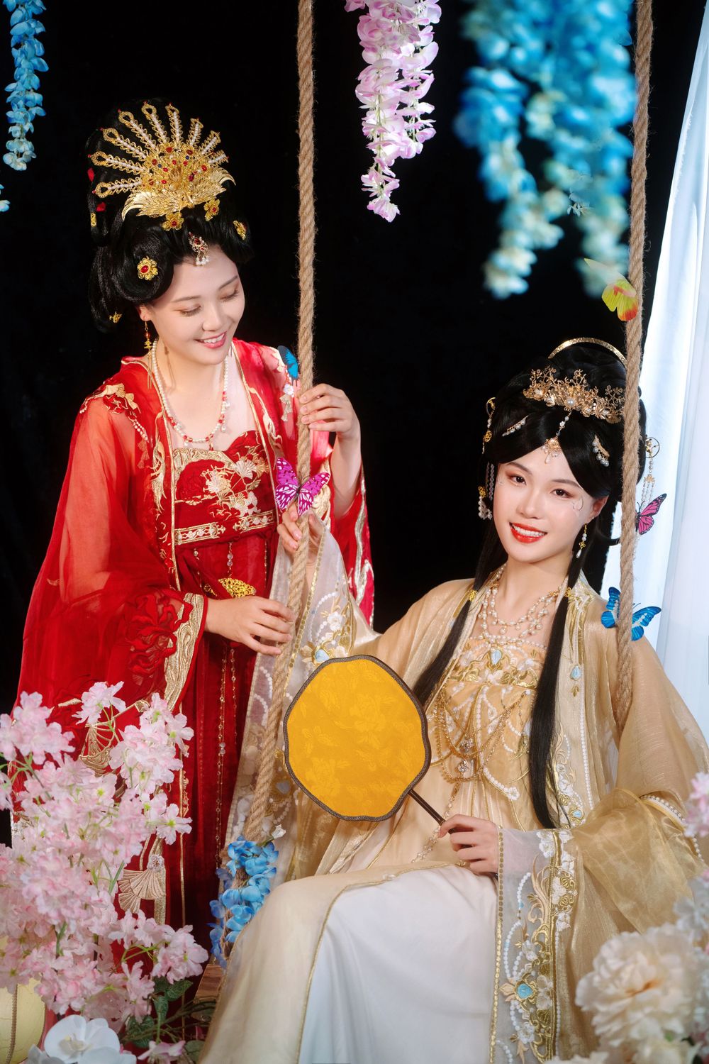 Elegant backlit studio portrait of mother and daughter in Tang Dynasty Hanfu on a swing among wisteria, by Imagine Image Studio.