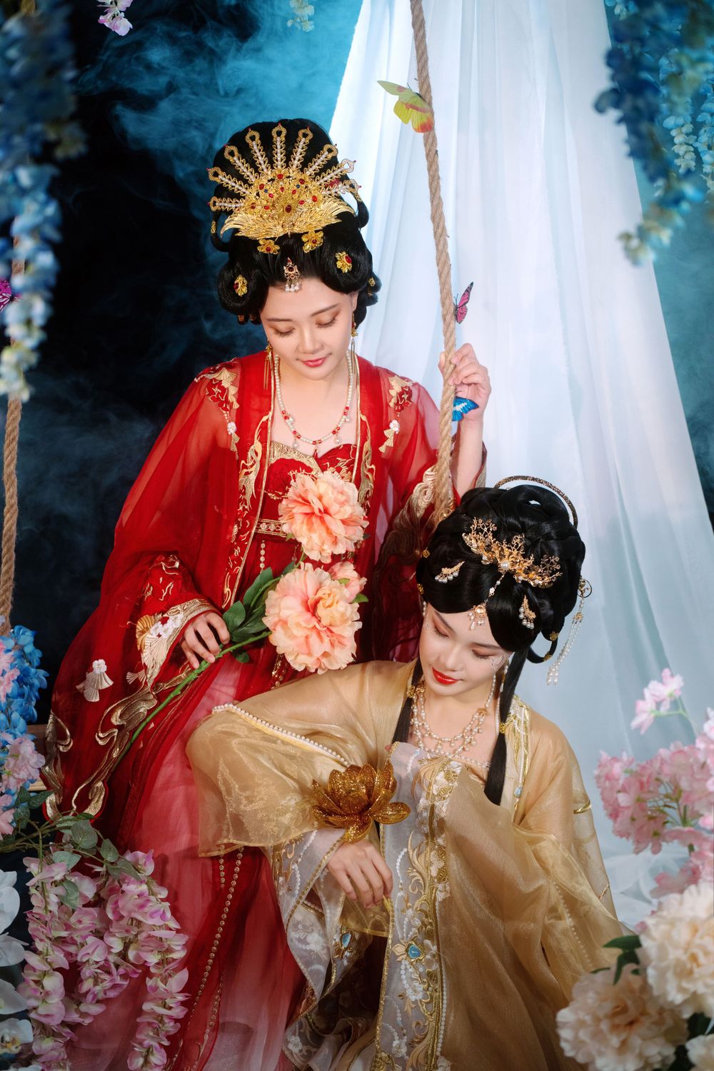 Elegant backlit studio portrait of mother and daughter in Tang Dynasty Hanfu on a swing among wisteria, by Imagine Image Studio.