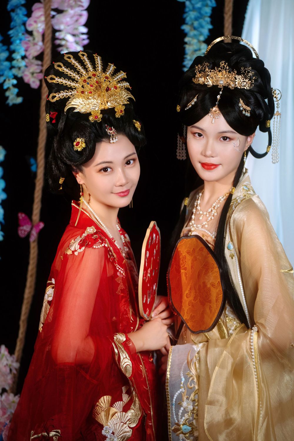 Elegant backlit studio portrait of mother and daughter in Tang Dynasty Hanfu on a swing among wisteria, by Imagine Image Studio.