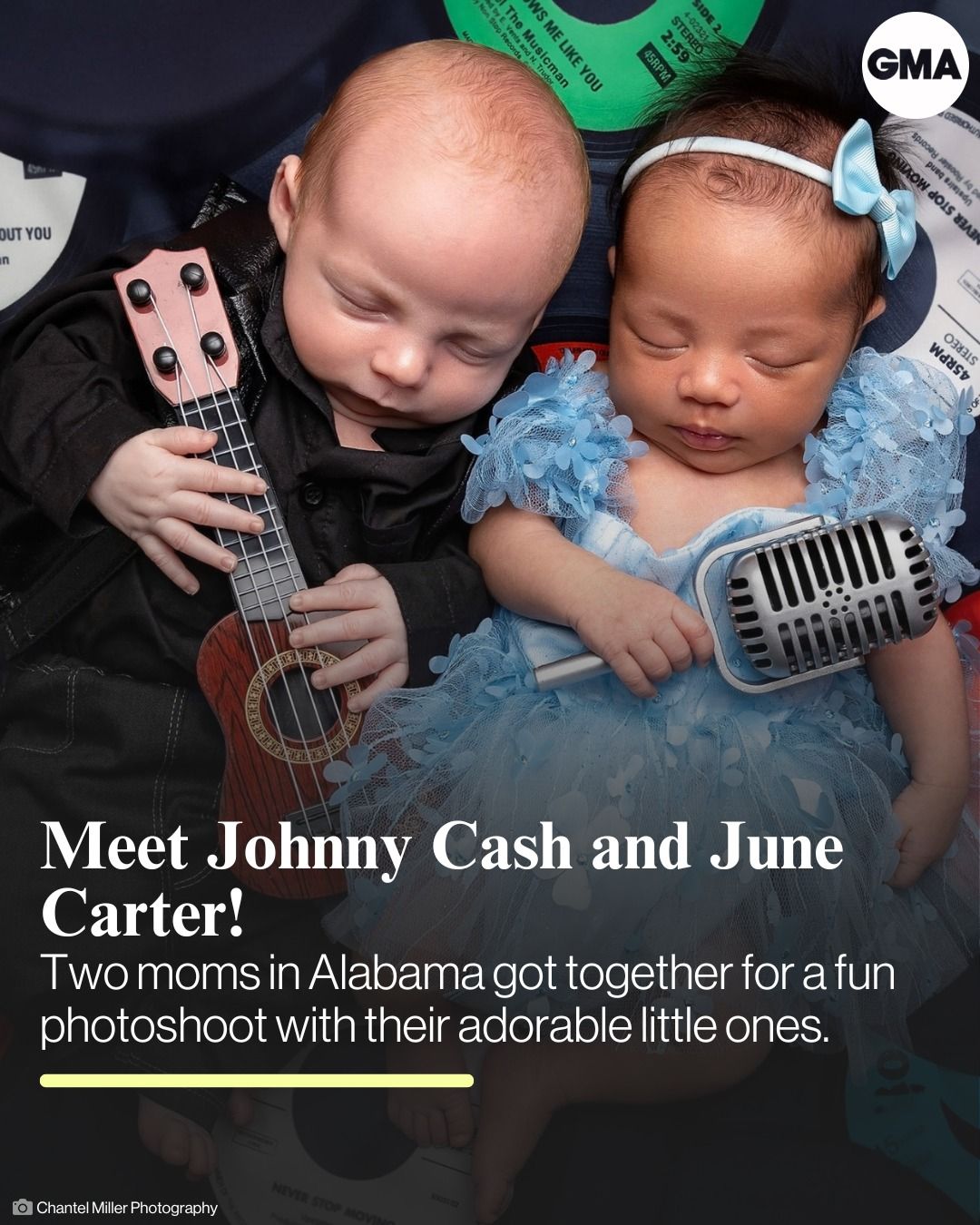 Two sleeping babies dressed in musical themed outfits pose with a tiny guitar and microphone prop on blue background.