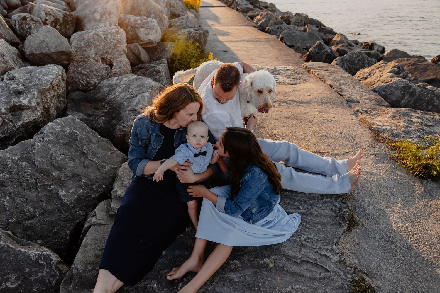 Family photo session at sunset on Sheboygan Wisconsin beach shoreline with Essence Rose Photography.
