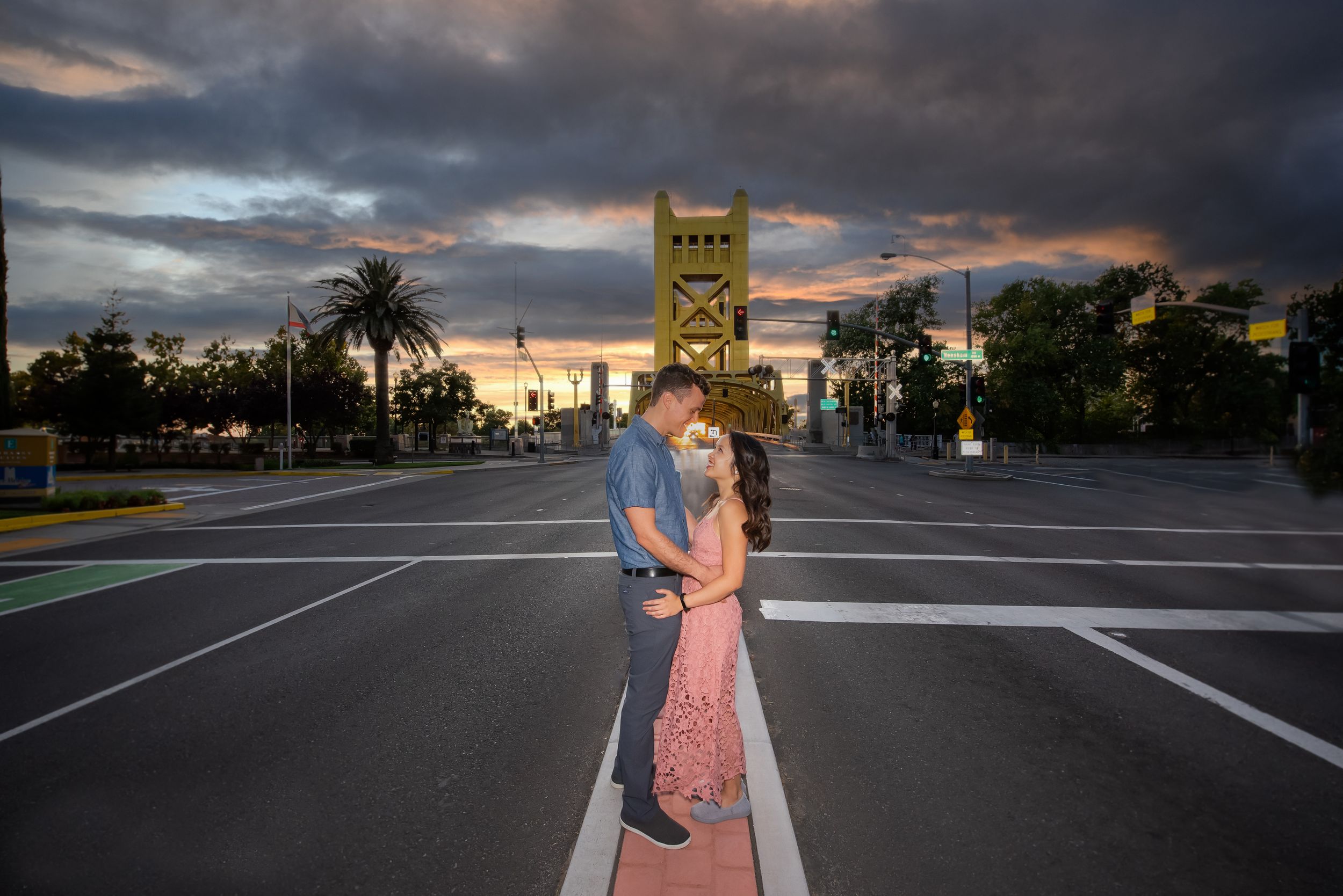 Engagement portrait in front of the Tower Bridge in Sacramento, Calif by Sacramento photographer, Ashley Nicole Baeza.
