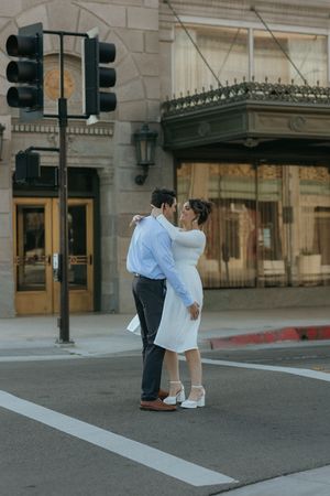 couple standing close together during a couple's portrait session in an urban setting