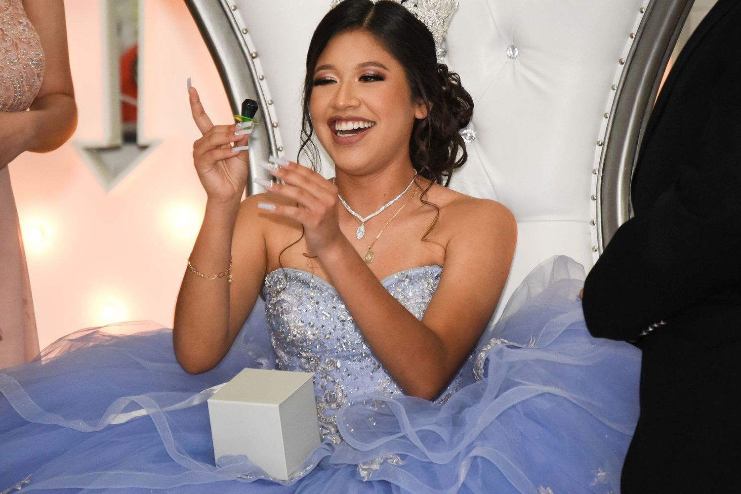 Guests taking venue decorations during open invite Quince celebration highlighting venue responsibility, planning and guest supervision