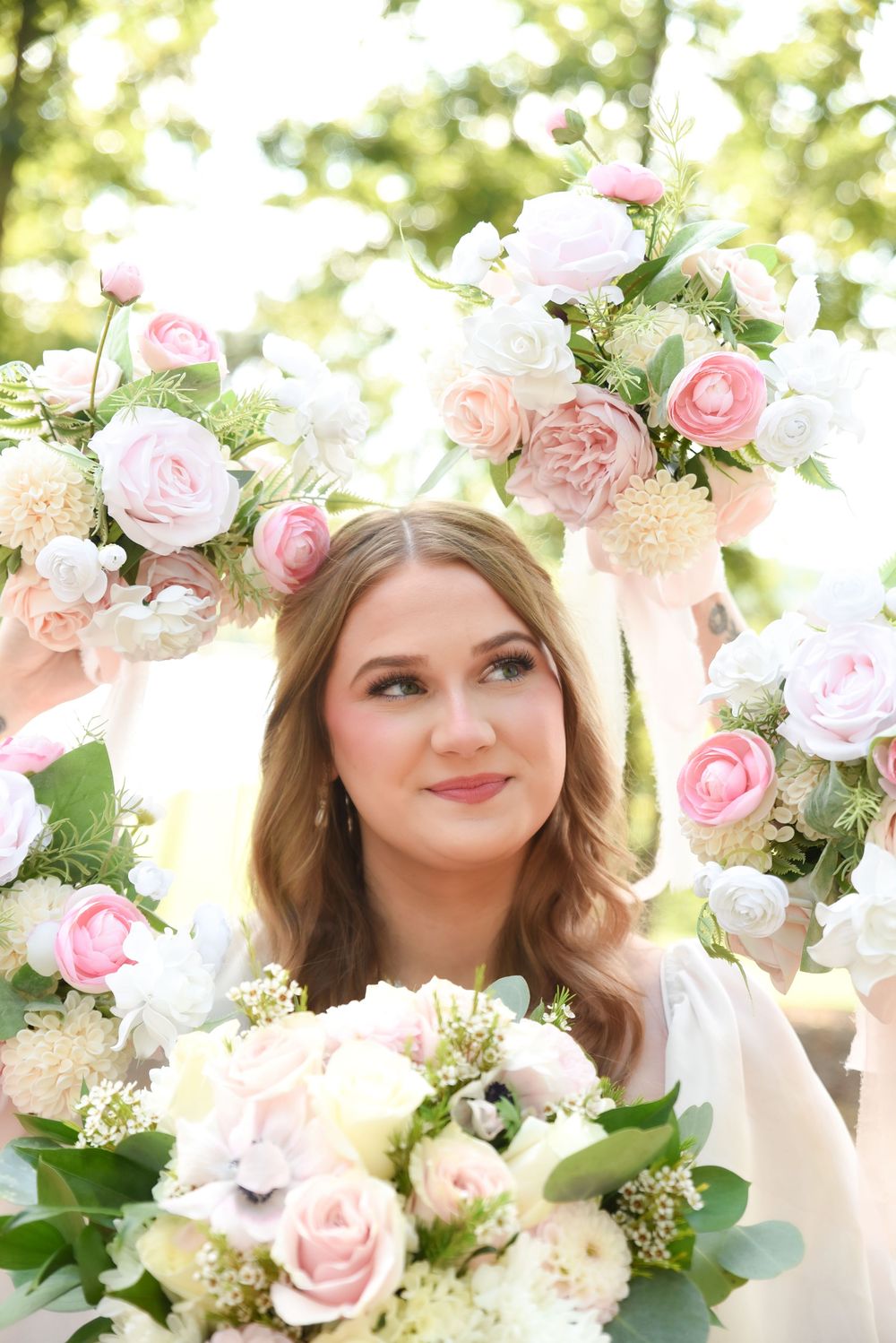 bride surrounded by flowers