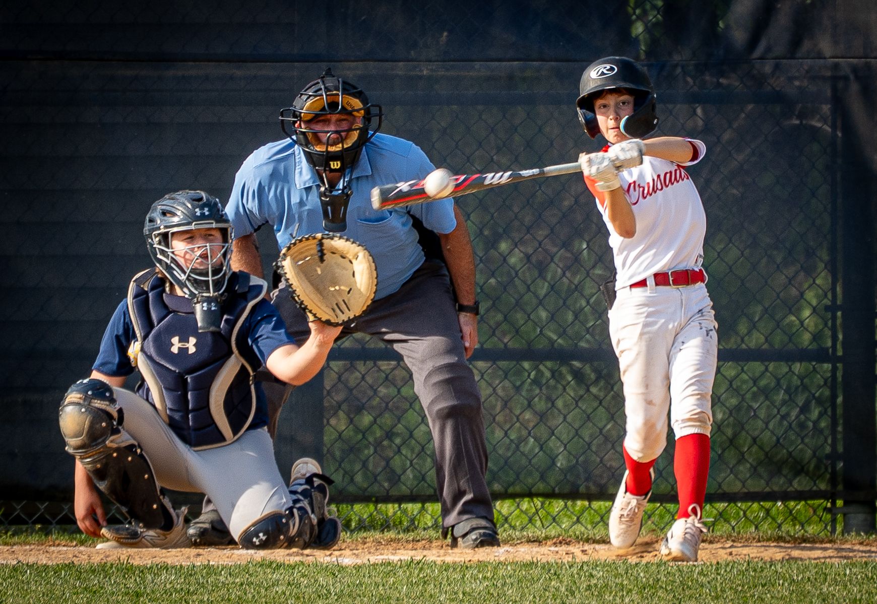Youth baseball player up to bat.