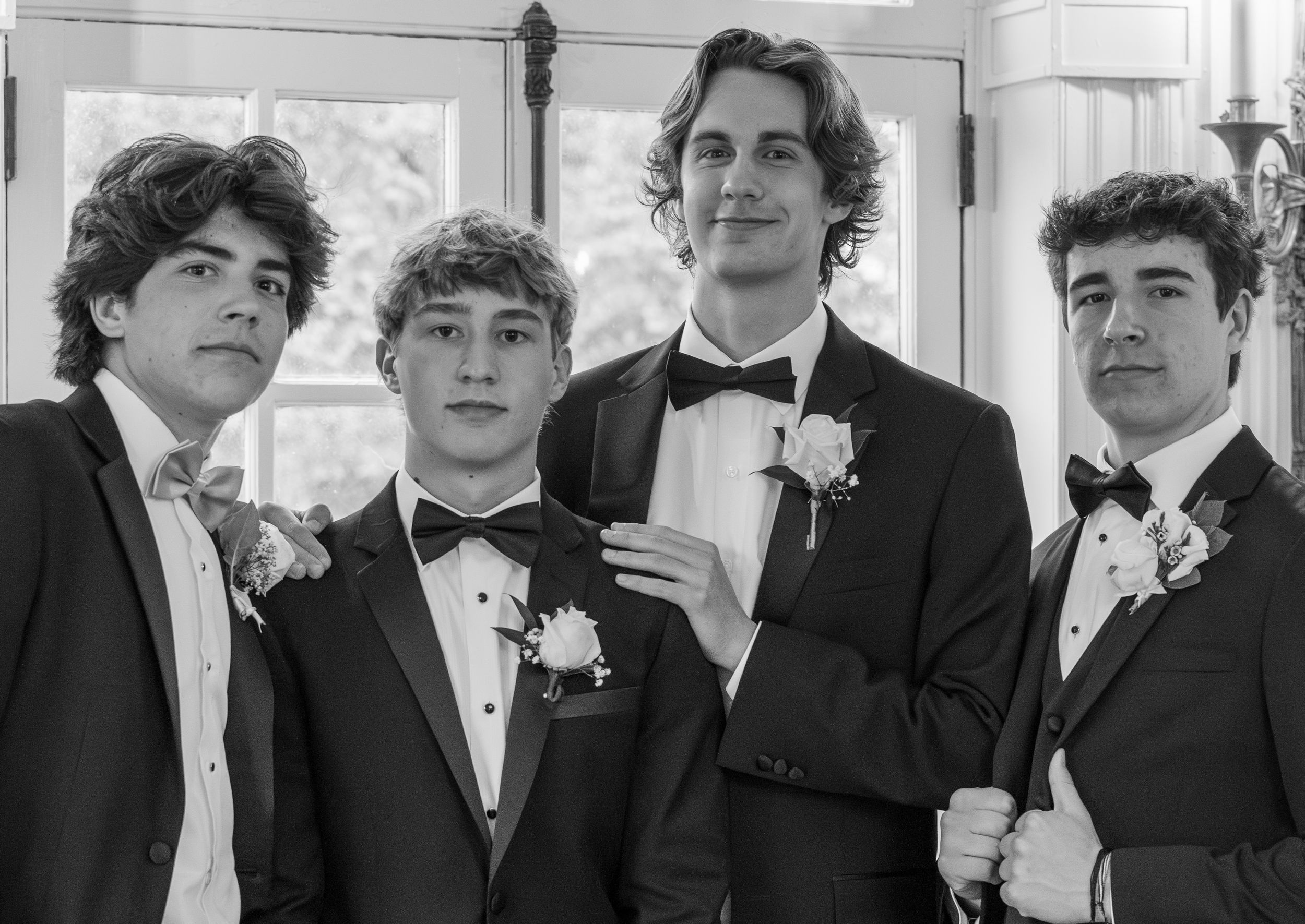 High school boys pose at prom.