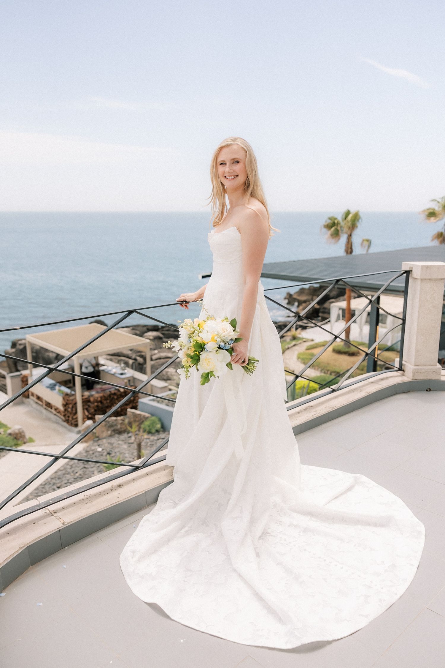 Bride portrait at the balcony of the farol Hotel in cascais before her destination wedding ceremony in Arriba, Portugal.