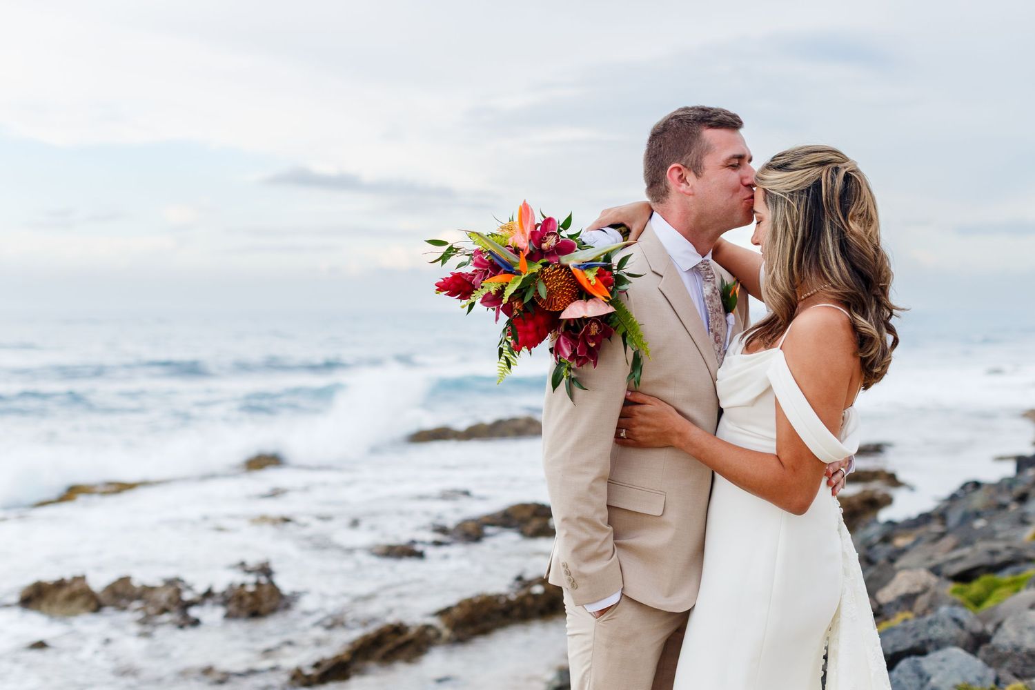 Wedding portrait. Bride and groom with the ocean in the background. Balneario del Escambrón, Old San Juan, Puerto Rico.