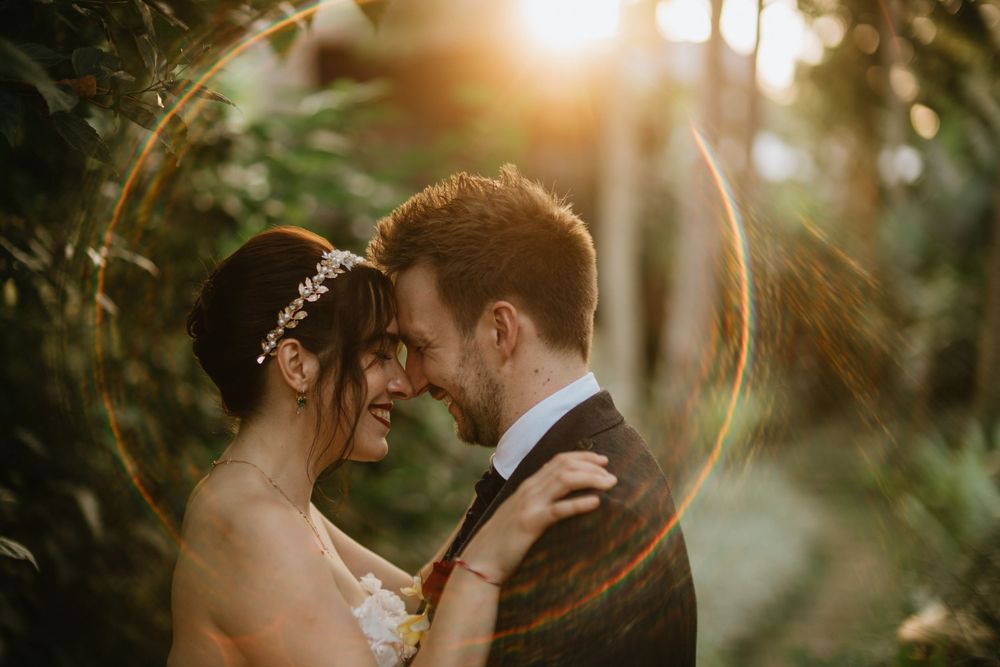 Wedding couple surrounded by tropical greenery at Capella Ubud Bali