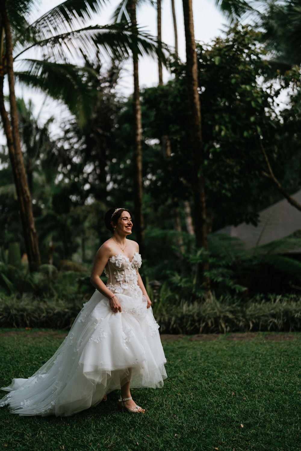 Wedding couple surrounded by tropical greenery at Capella Ubud Bali