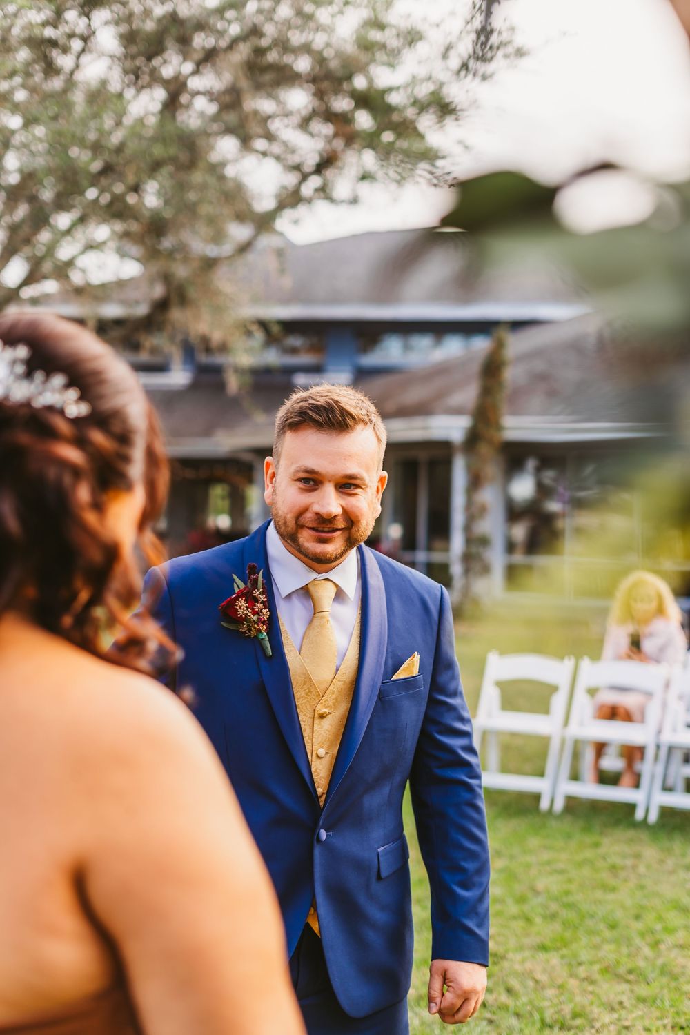 Channel Side Club in Palm Coast Florida. Wedding photography of outdoor ceremony. Navy blue suits and red bridesmaids gowns. Princess gown.