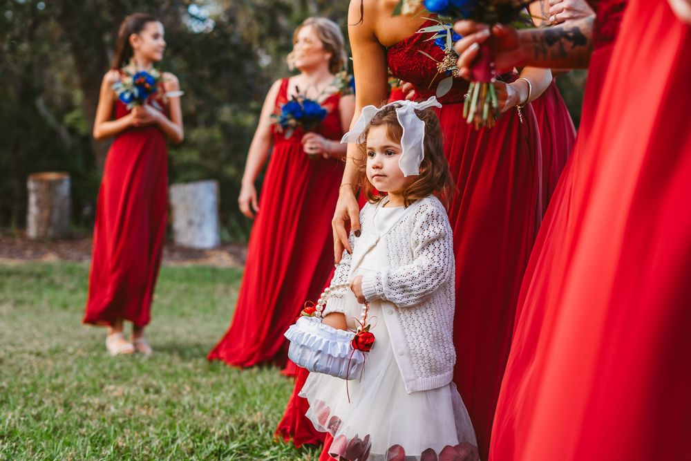 Channel Side Club in Palm Coast Florida. Wedding photography of outdoor ceremony. Shy flower girl.